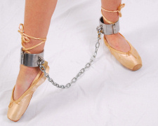 Ballet dancer Lilly in shackles